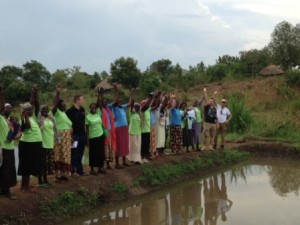 The chefs together with the women from the Afula group inspect the pond that was built earlier this year on the Dig for Good project.